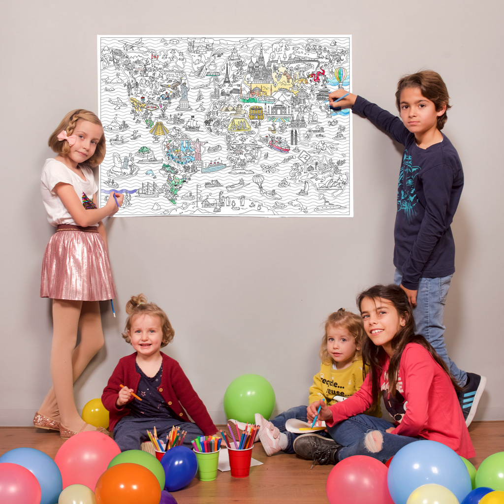 Kids colouring the wonders of the world map on the wall